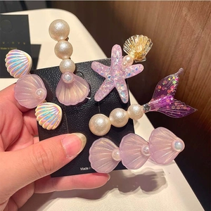 5-piece mermaid themed hair clips with starfish, shells, and pearls for little girls
