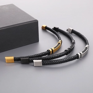 Braided leather bracelets in black with polished gold, silver and black metal clasps