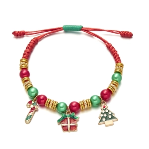 Detail of Christmas beaded rope bracelet with Santa gift box and candy cane charms