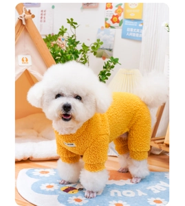 Detail of warm yellow fleece pet jumpsuit for small dogs shown in a cozy home setting
