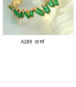 Detailed macro view of a gold ring featuring emerald-green rectangular zircon wave pattern