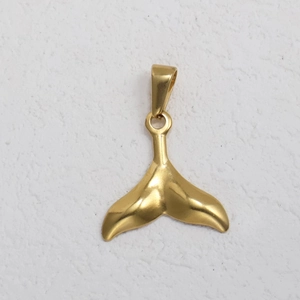 Detailed view of a shiny gold whale tail pendant made of durable stainless steel