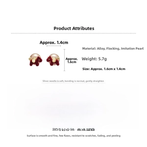 Detailed macro view of red flocked pony shape with white pearls on earrings