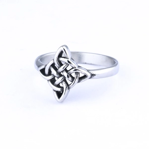 Detailed macro view of vintage Celtic knot silver ring with retro distressed texture finish