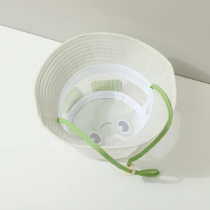 Detail of mesh lining and cartoon frog pattern inside children's sun bucket hat