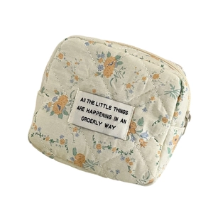 Floral quilted square storage pouch for cosmetics and sanitary napkins in cream beige