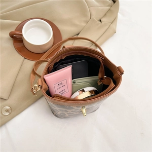 Stylish leopard print bucket bag for women with brown PU trim and interior space view