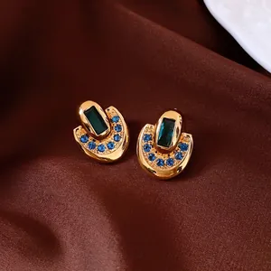 Boucles d'oreilles vintage plaquées or 18 carats avec pierre bleue et cristaux