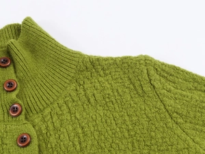 Close-up of grass green knit sweater featuring a stand collar with four brown buttons