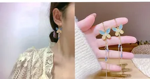 Detail of 925 silver needle tassel earrings featuring blue and yellow butterfly designs