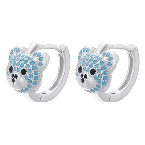 Macro shot of silver teddy bear earrings with pavé set blue and black crystals