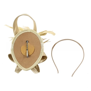Detail view of champagne gold fascinator set showing feather base and headband