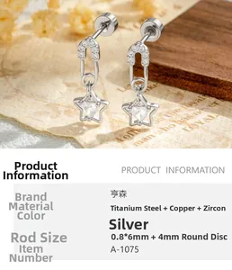 Detail of paperclip star earring with heart zircon inlay on vintage background