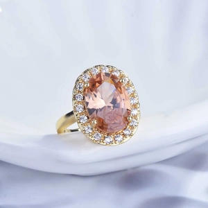 Macro detail of luxury champagne oval gemstone ring with micro-pave diamond halo