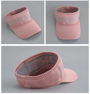 Detail view of pink knitted sun visor with SPORT text and breathable mesh structure