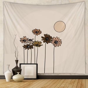 Close-up of bohemian tapestry with floral illustrations and sun motif in earthy tones