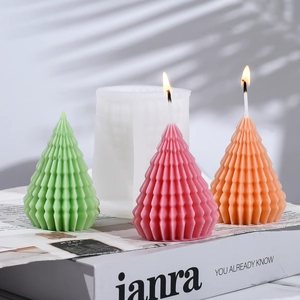 Detail of geometric Christmas tree silicone mold and colorful finished scented candles