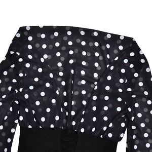 Detailed back view of a polka dot mesh top featuring an elegant tie-back waist design