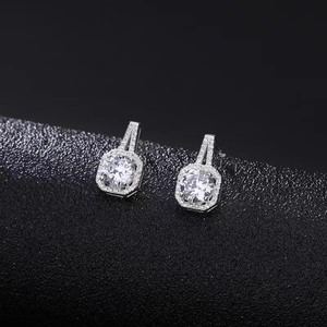 Classic silver halo stud earrings with cushion-cut cubic zirconia in a split-shank setting