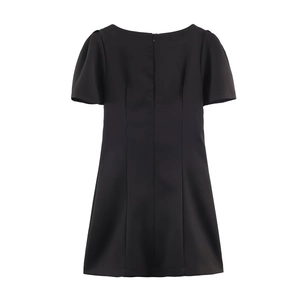 Detailed back view of a black A-line mini dress featuring puffy sleeves and hidden zipper