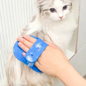 Blue silicone pet bath brush with adjustable handle for cat grooming and massage