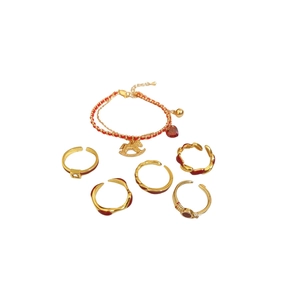 Gold plated ring and bracelet set with red heart charms and red enamel accents