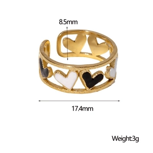 Detailed view of the 8.5mm width heart-shaped gold ring with black and white enamel fill