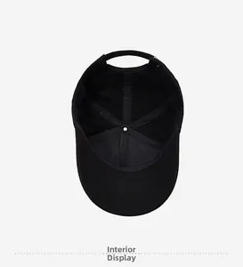 Interior view of black cotton baseball cap showing cross-stitching and lining details