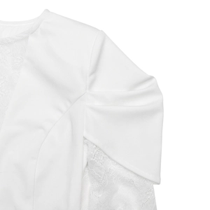 Close-up of elegant white lace stitching and smooth fabric texture on the dress shoulder