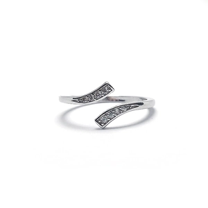 Silver open ring with a wave design and zircon stones on a clean white background