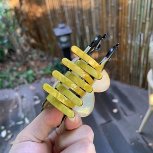 Striped acetate bee hair claw clip in vibrant yellow and black for women hairstyles