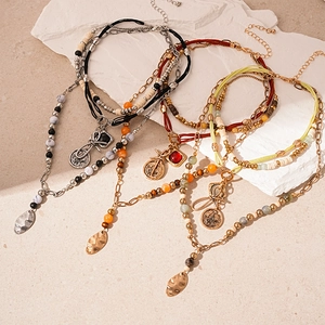 Bohemian multi-layer necklace with vintage wood beads and geometric coin pendants