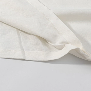 Elegant white V-neck linen blouse with loose batwing sleeves and premium stitching