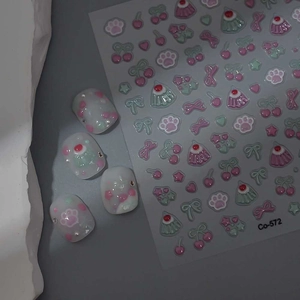 Detailed view of Co-572 nail stickers featuring pink cat paws and cherry motifs