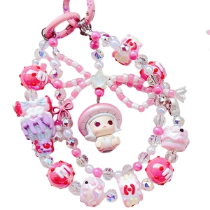 Pink DIY phone strap featuring hand-painted beads, mushroom charms and a cute toy figure