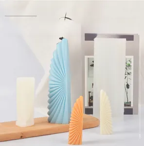 Macro detail of horn-shaped silicone candle mold showing fan-folded texture and finished product