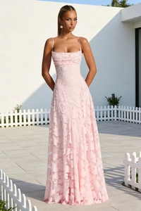 Detailed view of the intricate 3D floral applique texture on a pink slip dress