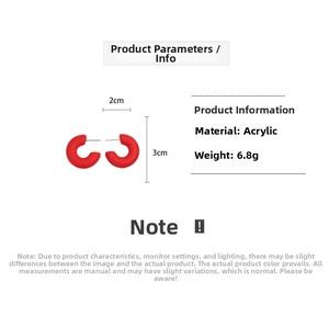 Detailed view of red acrylic C-shaped earrings with 2cm width and 3cm height dimensions