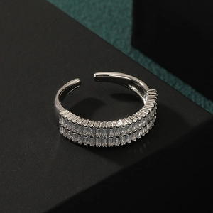 Elegant adjustable silver ring with double row rectangular diamonds on black stand