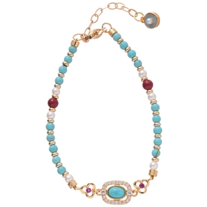 Vintage style beaded bracelet with turquoise, pearls, and gold floral metal pendant