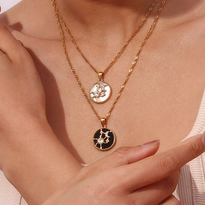 18K gold plated sun and moon pendant necklaces with mother of pearl and black enamel details