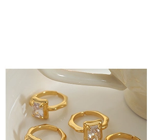 Detail shot of golden irregular bands featuring rectangular faceted crystal gemstones