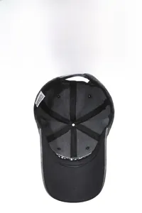 Detail of black cotton baseball cap interior with embroidery and adjustable strap