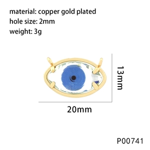 Detail view of 18K gold plated copper evil eye pendant with 20mm x 13mm dimensions
