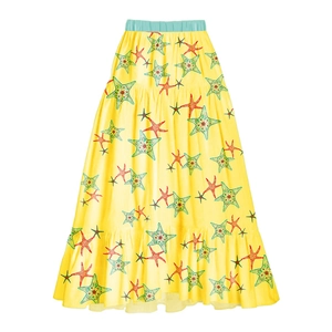 Detail of summer starfish print skirt with yellow base and tiered ruffle hem design