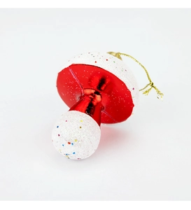 Red mushroom Christmas ornament with metallic finish and snowy white glitter texture