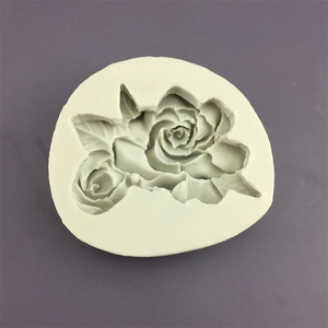 Oval silicone mold featuring rose and leaf patterns for fondant, soap or candles