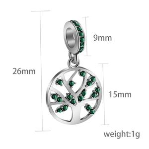 Macro detail of silver tree of life charm with green stones and precise dimensions