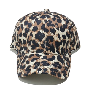Detailed close-up of a vintage leopard print baseball cap with classic curved brim