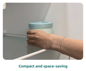 Compact blue silicone cylinder ice mold container shown being placed inside a refrigerator